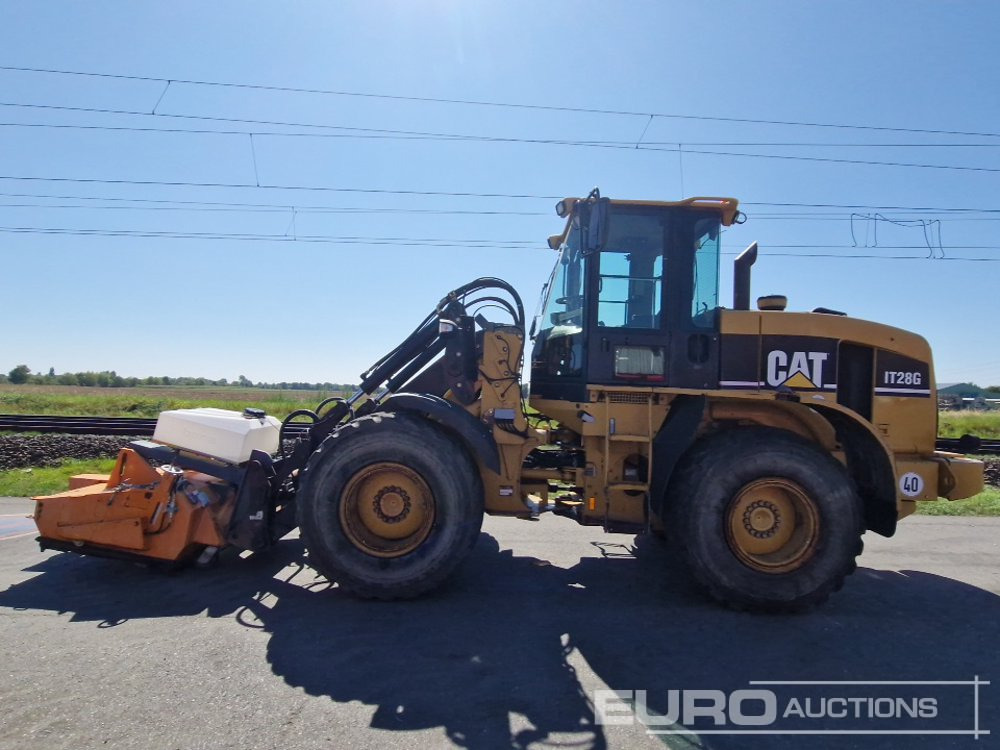 CAT IT28G - Gumikerekes homlokrakodó: 2 kép. CAT IT28G - Gumikerekes homlokrakodó: 2 kép.