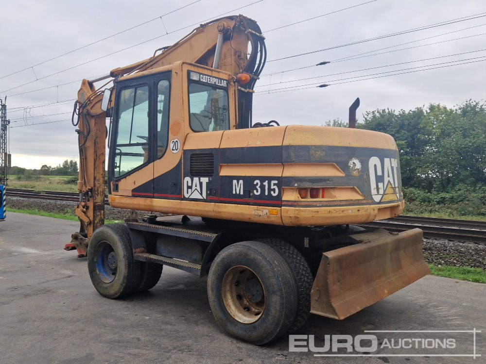 CAT M315 - Gumikerekes kotró: 3 kép. CAT M315 - Gumikerekes kotró: 3 kép.