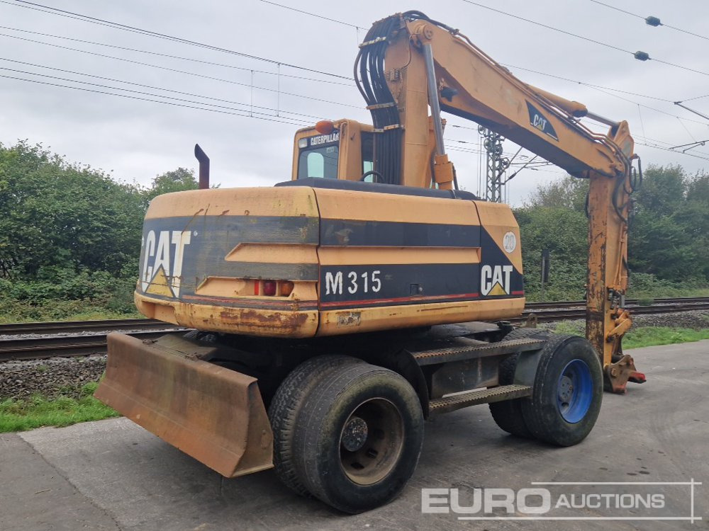 CAT M315 - Gumikerekes kotró: 5 kép. CAT M315 - Gumikerekes kotró: 5 kép.