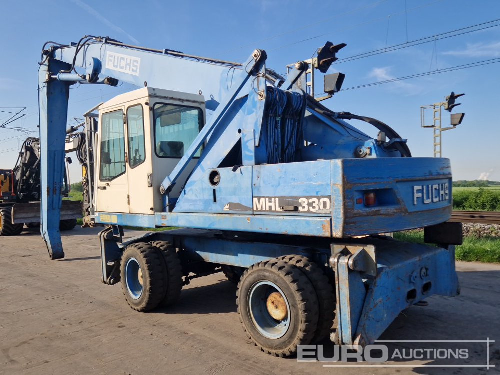 Fuchs MHL 330 - Gumikerekes kotró: 3 kép. Fuchs MHL 330 - Gumikerekes kotró: 3 kép.
