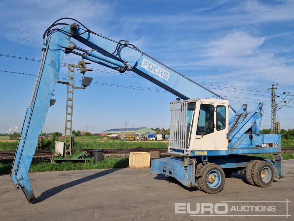 Fuchs MHL 330 - Gumikerekes kotró: 1 kép. Fuchs MHL 330 - Gumikerekes kotró: 1 kép.