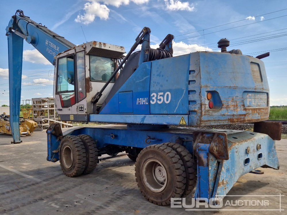 Fuchs MHL350 - Gumikerekes kotró: 4 kép. Fuchs MHL350 - Gumikerekes kotró: 4 kép.