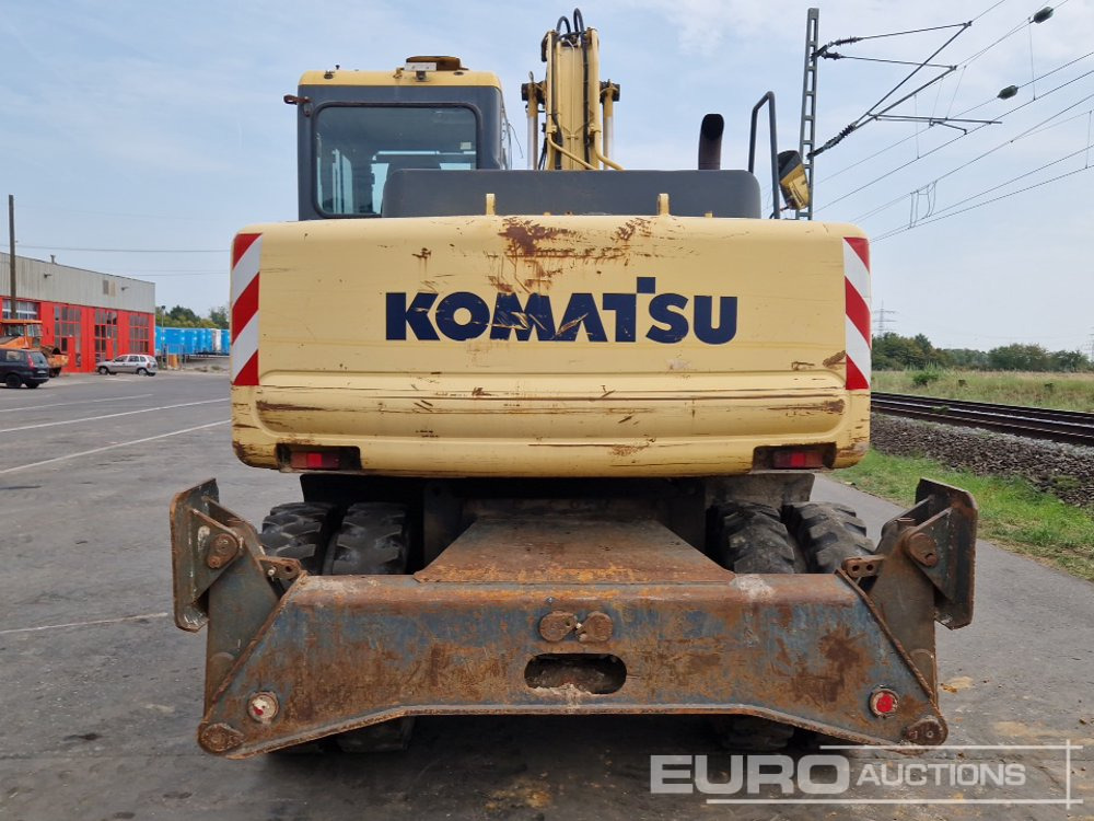 Komatsu PW130-7K - Gumikerekes kotró: 4 kép. Komatsu PW130-7K - Gumikerekes kotró: 4 kép.