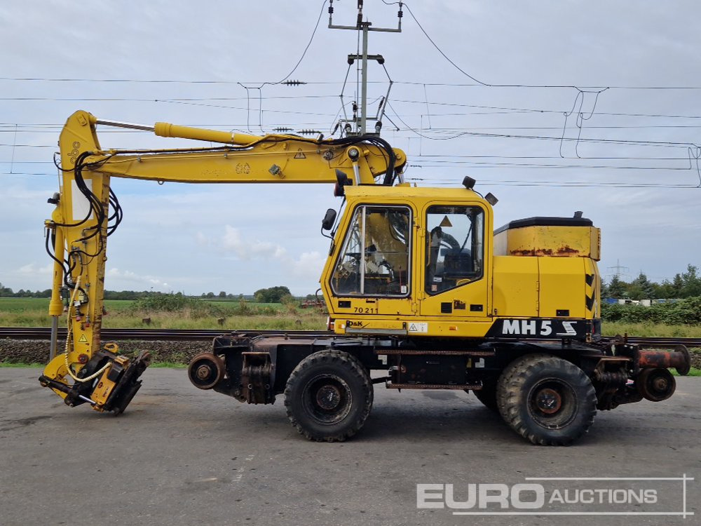 O & K MH5 S - Gumikerekes kotró: 2 kép. O & K MH5 S - Gumikerekes kotró: 2 kép.