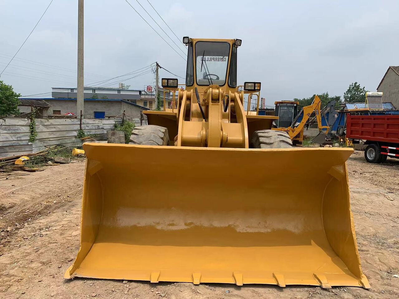 CATERPILLAR 950E - Gumikerekes homlokrakodó: 3 kép. CATERPILLAR 950E - Gumikerekes homlokrakodó: 3 kép.