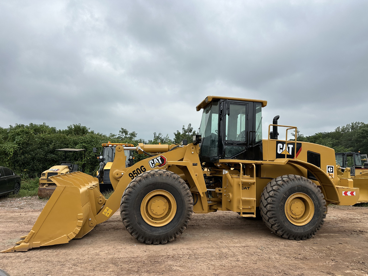 CATERPILLAR 950G - Gumikerekes homlokrakodó: 3 kép. CATERPILLAR 950G - Gumikerekes homlokrakodó: 3 kép.