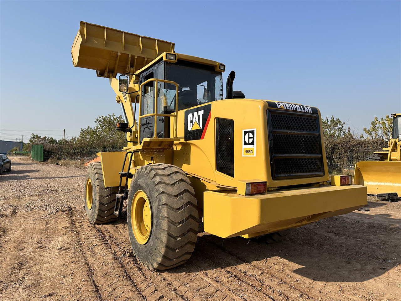 CATERPILLAR 966G - Gumikerekes homlokrakodó: 3 kép. CATERPILLAR 966G - Gumikerekes homlokrakodó: 3 kép.