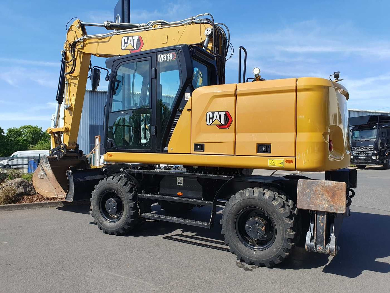 CAT M318 / 2022 / nur 286h! / Tieflöffel / Pratzen - Gumikerekes kotró: 3 kép. CAT M318 / 2022 / nur 286h! / Tieflöffel / Pratzen - Gumikerekes kotró: 3 kép.