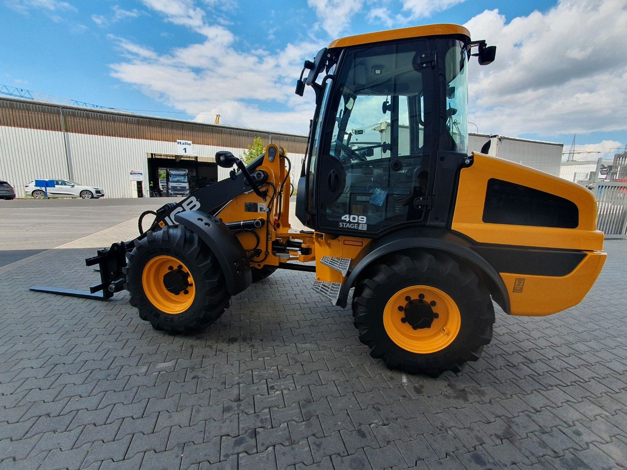 JCB 409 SV / Neufahrzeug / Gabel - Gumikerekes homlokrakodó: 5 kép. JCB 409 SV / Neufahrzeug / Gabel - Gumikerekes homlokrakodó: 5 kép.