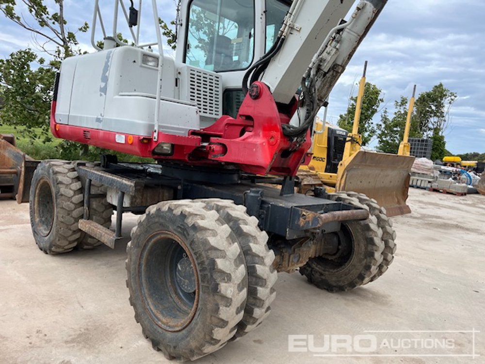2011 Takeuchi TB175W - Gumikerekes kotró: 4 kép. 2011 Takeuchi TB175W - Gumikerekes kotró: 4 kép.