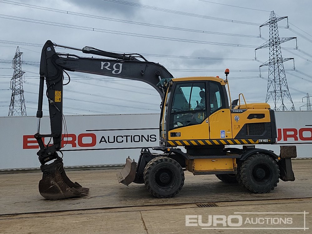 2012 Volvo EW140D - Gumikerekes kotró: 2 kép. 2012 Volvo EW140D - Gumikerekes kotró: 2 kép.