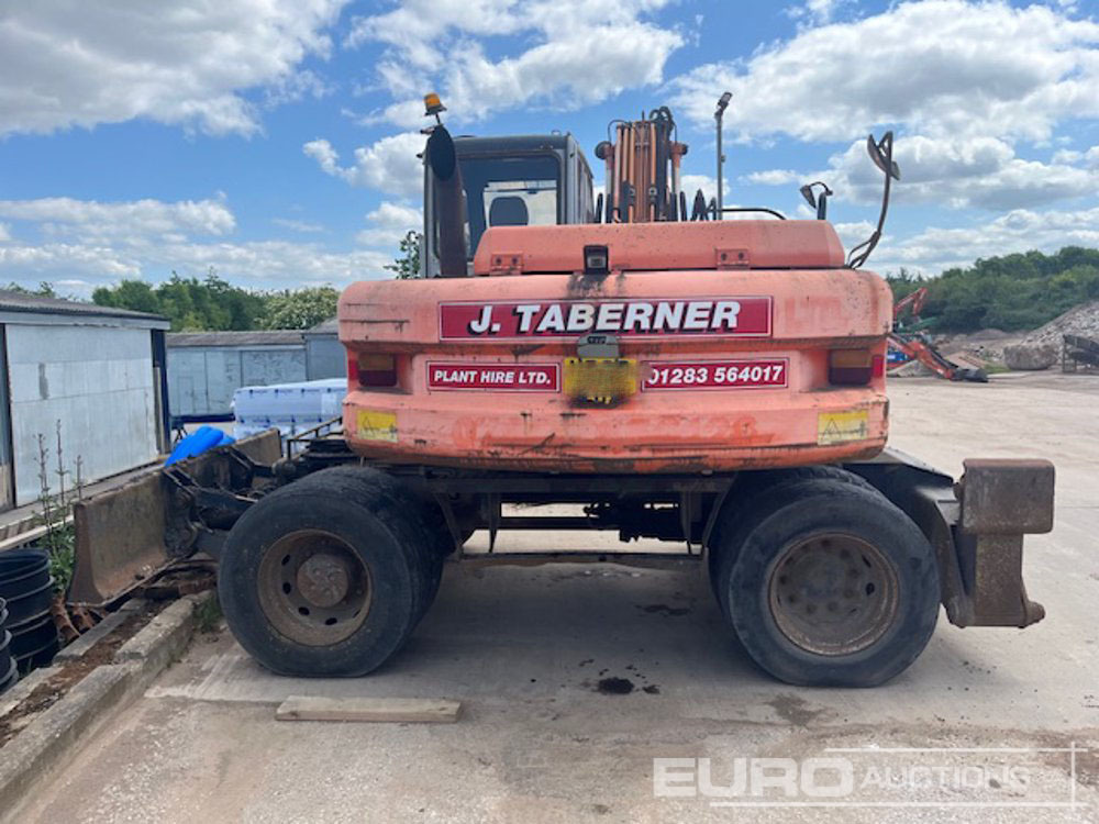 Fiat Hitachi EX135W - Gumikerekes kotró: 5 kép. Fiat Hitachi EX135W - Gumikerekes kotró: 5 kép.