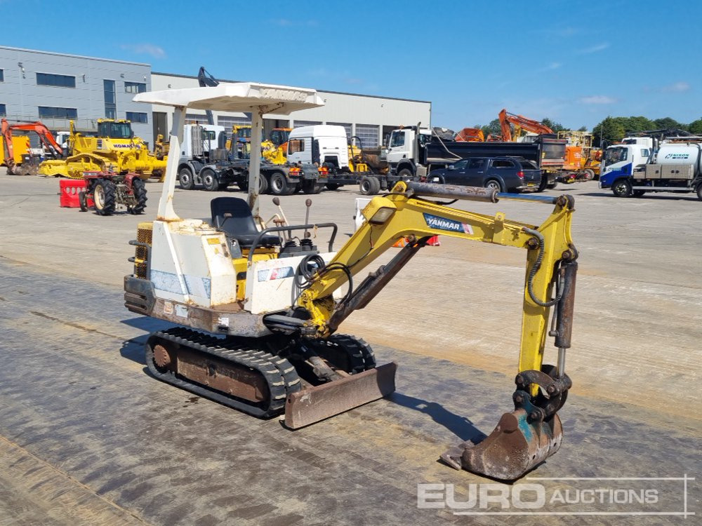 Minikotró Yanmar B12-1: 7 kép.