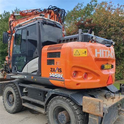 Hitachi ZX145 WT-6 - Gumikerekes kotró: 4 kép. Hitachi ZX145 WT-6 - Gumikerekes kotró: 4 kép.