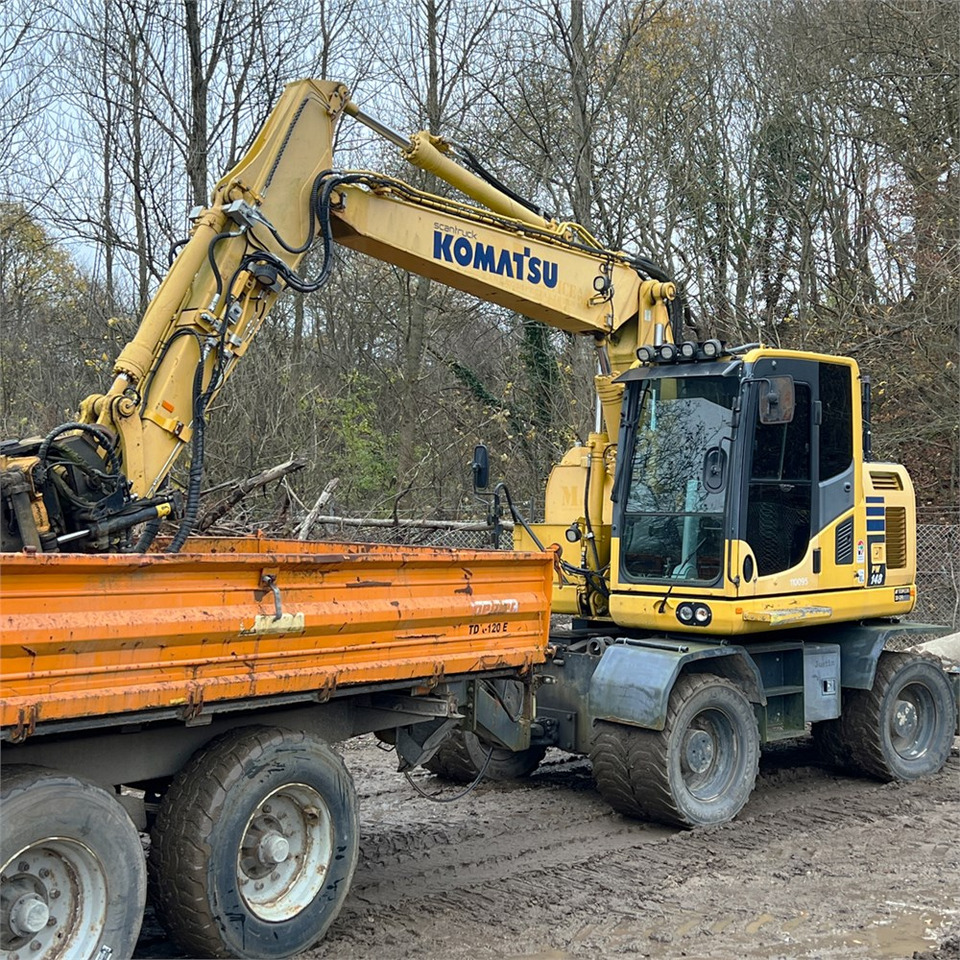 Komatsu PW148-10 - Gumikerekes kotró: 3 kép. Komatsu PW148-10 - Gumikerekes kotró: 3 kép.