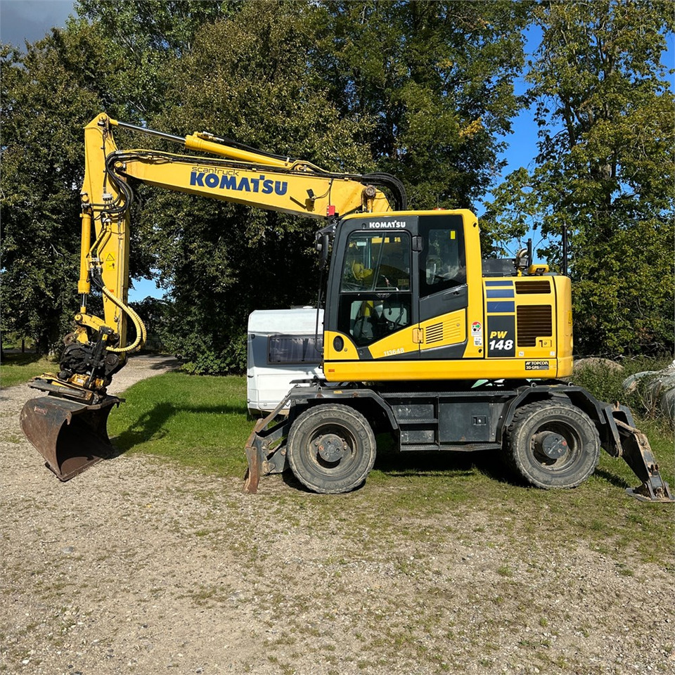 Komatsu PW148-11 - Gumikerekes kotró: 1 kép. Komatsu PW148-11 - Gumikerekes kotró: 1 kép.