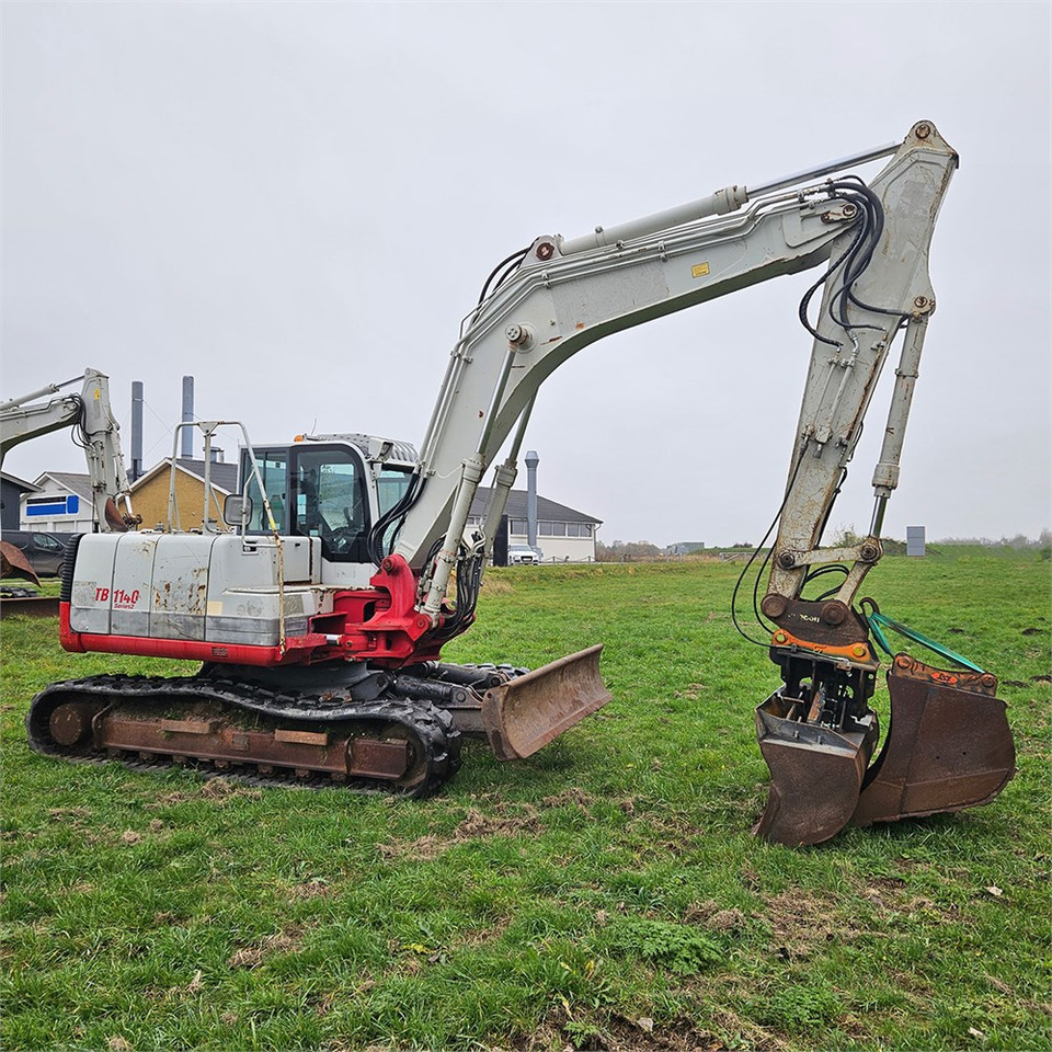 Lánctalpas kotró Takeuchi TB1140: 7 kép.