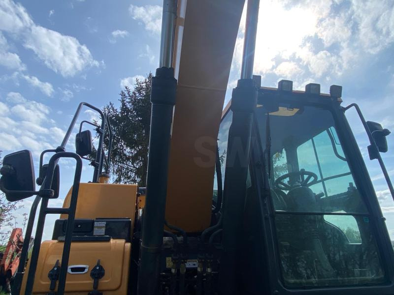 Hyundai HW 210 - Gumikerekes kotró: 3 kép. Hyundai HW 210 - Gumikerekes kotró: 3 kép.