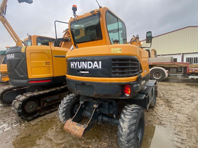 Hyundai ROBEX 55W-9A - Gumikerekes kotró: 5 kép. Hyundai ROBEX 55W-9A - Gumikerekes kotró: 5 kép.