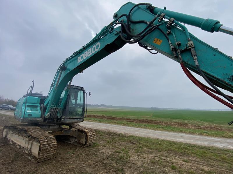 Kobelco SK 180N-10 - Lánctalpas kotró: 3 kép. Kobelco SK 180N-10 - Lánctalpas kotró: 3 kép.