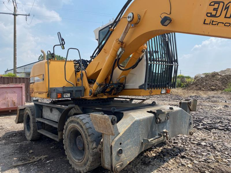 Gumikerekes kotró Liebherr A316Litronic: 11 kép.