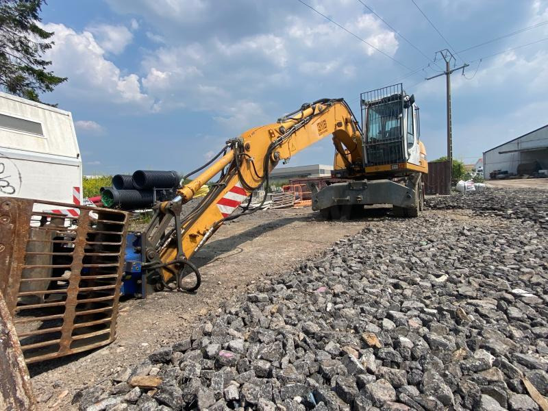 Gumikerekes kotró Liebherr A316Litronic: 10 kép.