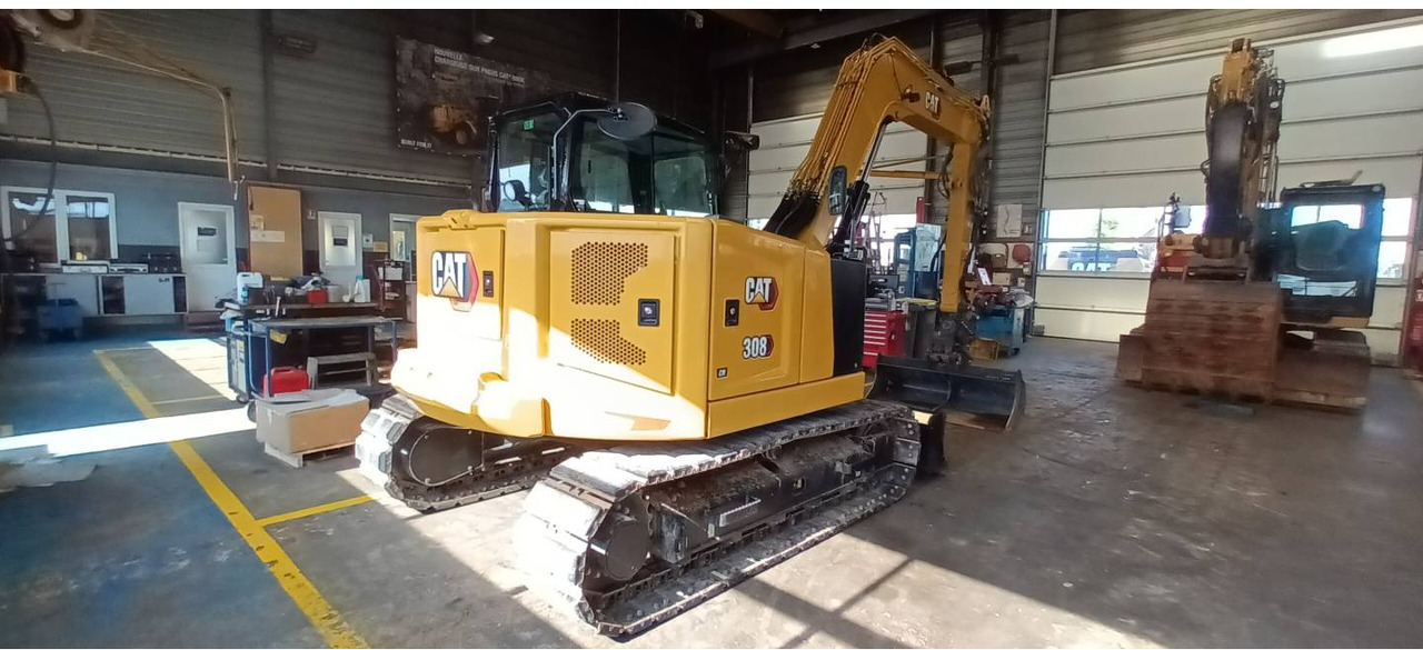 CAT 308 - Lánctalpas kotró: 3 kép. CAT 308 - Lánctalpas kotró: 3 kép.