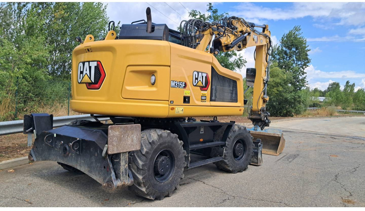 CAT M315F IVC - Gumikerekes kotró: 3 kép. CAT M315F IVC - Gumikerekes kotró: 3 kép.