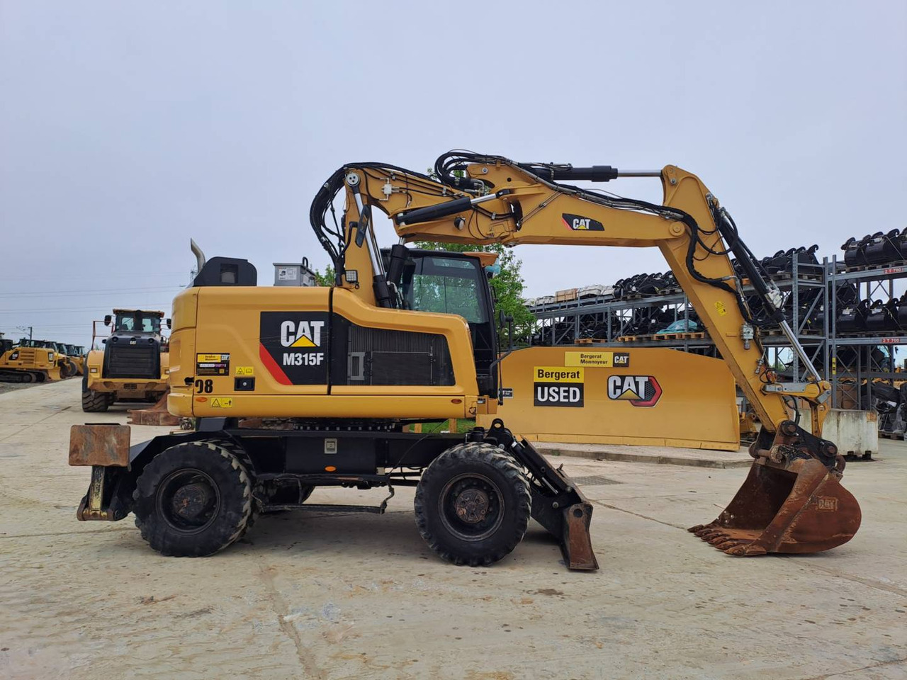 CAT M315F IVC - Gumikerekes kotró: 1 kép. CAT M315F IVC - Gumikerekes kotró: 1 kép.