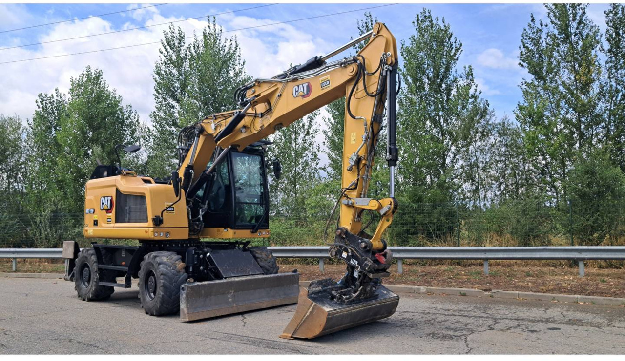 CAT M315F IVC - Gumikerekes kotró: 2 kép. CAT M315F IVC - Gumikerekes kotró: 2 kép.