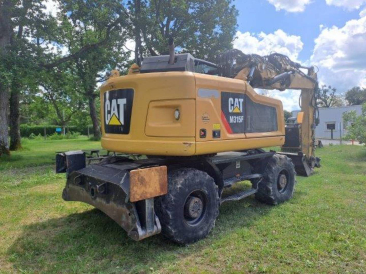 CAT M315F IVC - Gumikerekes kotró: 4 kép. CAT M315F IVC - Gumikerekes kotró: 4 kép.