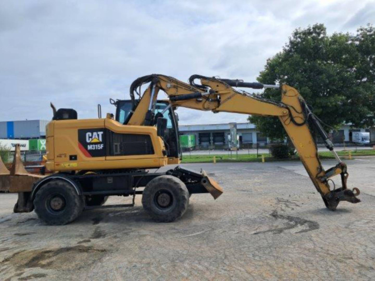 CAT M315F IVC - Gumikerekes kotró: 4 kép. CAT M315F IVC - Gumikerekes kotró: 4 kép.