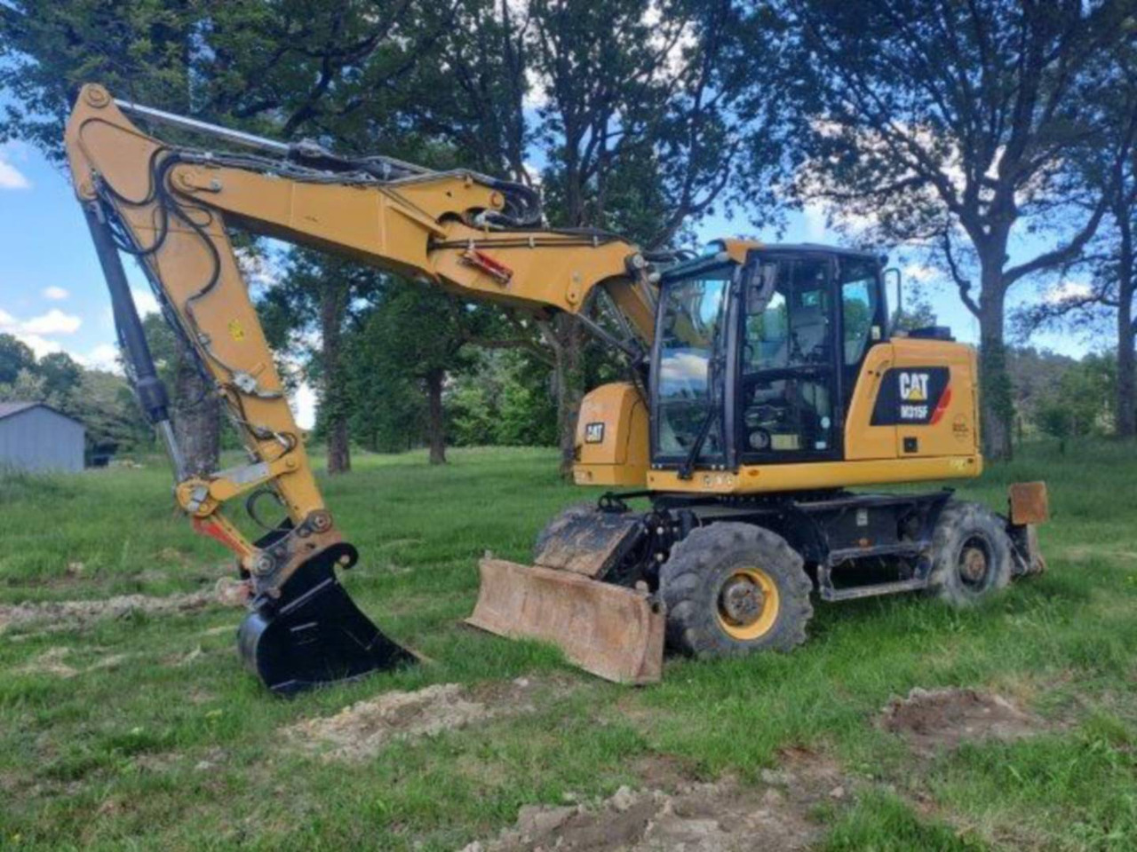 CAT M315F IVC - Gumikerekes kotró: 1 kép. CAT M315F IVC - Gumikerekes kotró: 1 kép.