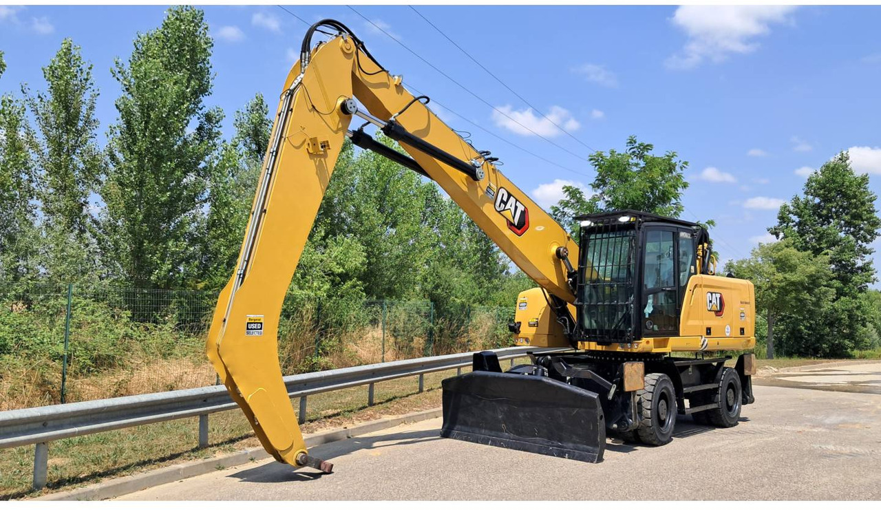 CAT MH3022-1 - Gumikerekes kotró: 1 kép. CAT MH3022-1 - Gumikerekes kotró: 1 kép.