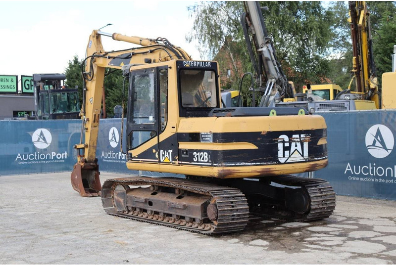 Caterpillar 312BL - Lánctalpas kotró: 4 kép. Caterpillar 312BL - Lánctalpas kotró: 4 kép.