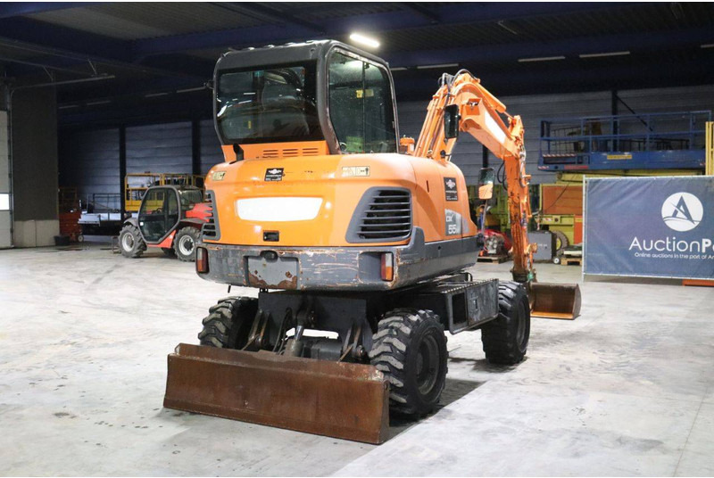 Doosan DX55WK - Gumikerekes kotró: 5 kép. Doosan DX55WK - Gumikerekes kotró: 5 kép.