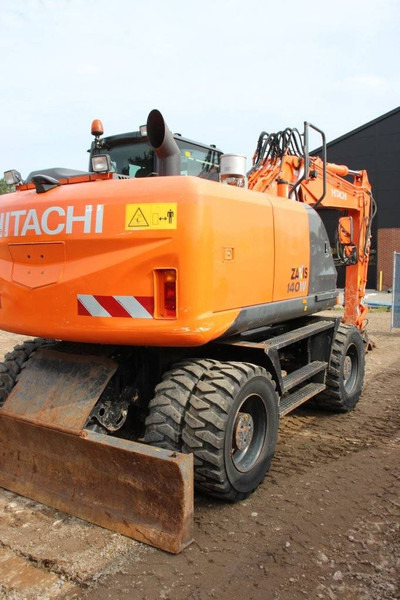 Hitachi ZX140W-5B - Gumikerekes kotró: 5 kép. Hitachi ZX140W-5B - Gumikerekes kotró: 5 kép.
