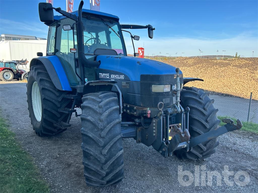 New Holland TM115 (2001) - Traktor: 2 kép. New Holland TM115 (2001) - Traktor: 2 kép.