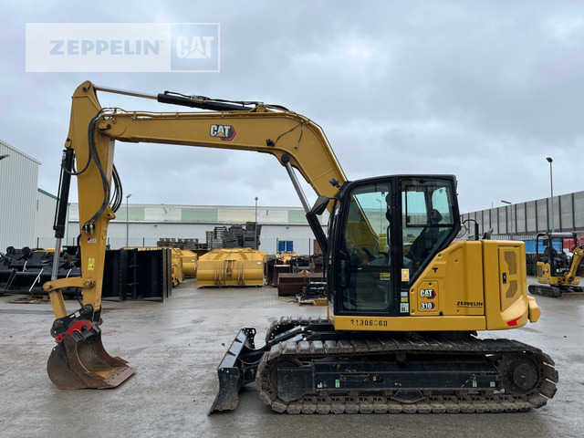 Cat 310 - Minikotró: 2 kép. Cat 310 - Minikotró: 2 kép.