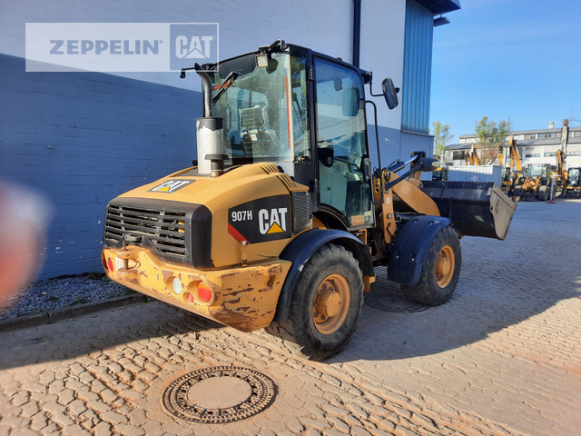 Cat 907H - Gumikerekes homlokrakodó: 3 kép. Cat 907H - Gumikerekes homlokrakodó: 3 kép.