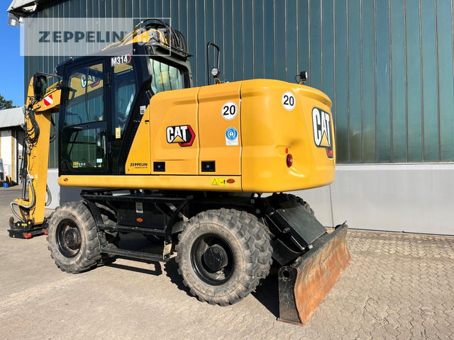 Cat M314-07A - Gumikerekes kotró: 3 kép. Cat M314-07A - Gumikerekes kotró: 3 kép.