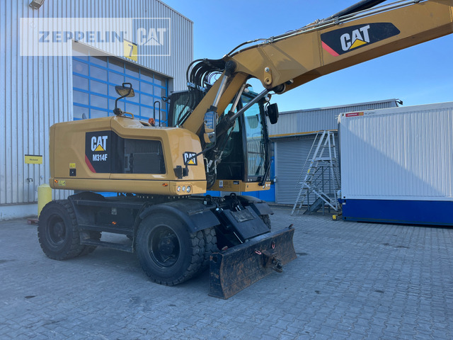 Cat M314F - Gumikerekes kotró: 2 kép. Cat M314F - Gumikerekes kotró: 2 kép.