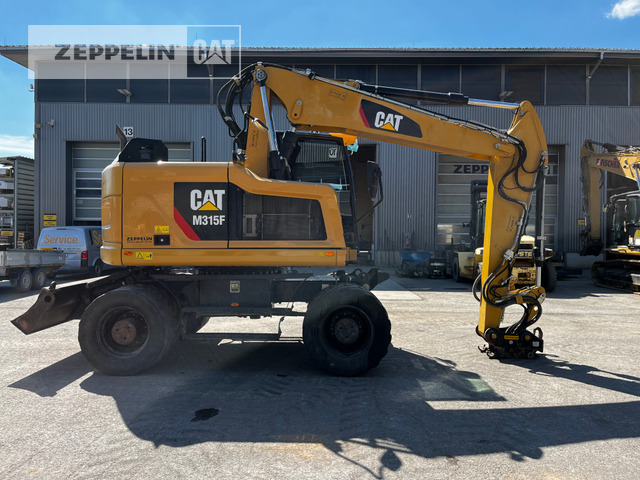 Cat M315F - Gumikerekes kotró: 5 kép. Cat M315F - Gumikerekes kotró: 5 kép.