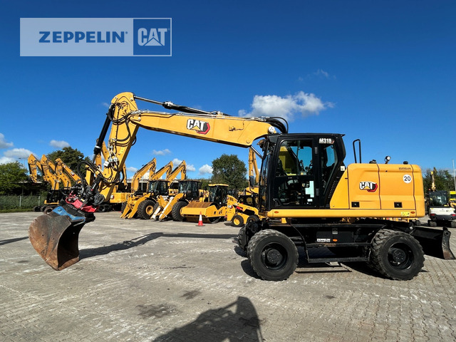 Cat M318-07A - Gumikerekes kotró: 1 kép. Cat M318-07A - Gumikerekes kotró: 1 kép.