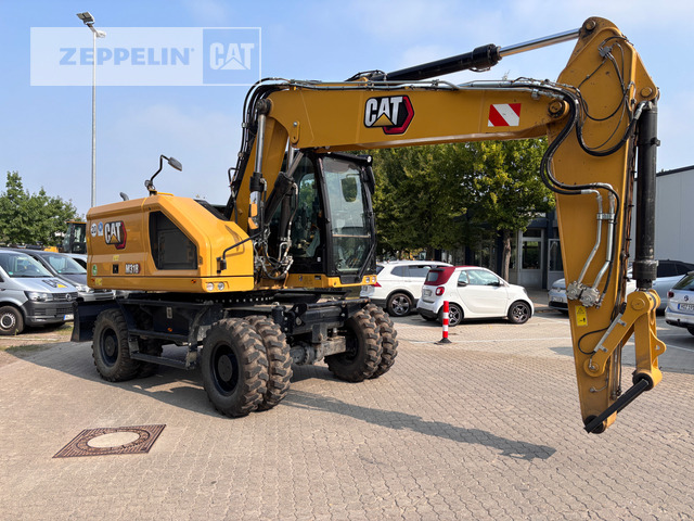 Cat M318-07A - Gumikerekes kotró: 2 kép. Cat M318-07A - Gumikerekes kotró: 2 kép.