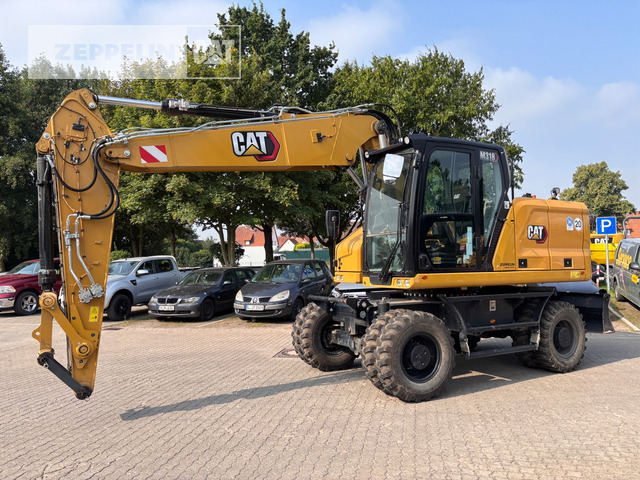 Cat M318-07A - Gumikerekes kotró: 1 kép. Cat M318-07A - Gumikerekes kotró: 1 kép.