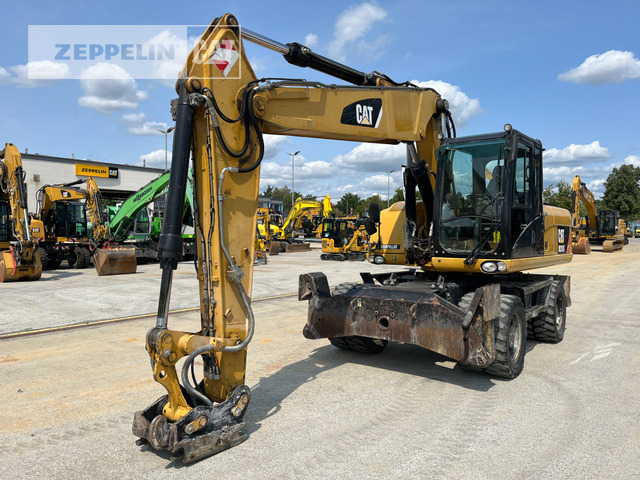 Cat M318D - Gumikerekes kotró: 1 kép. Cat M318D - Gumikerekes kotró: 1 kép.