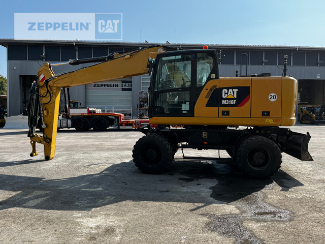 Cat M318F - Gumikerekes kotró: 1 kép. Cat M318F - Gumikerekes kotró: 1 kép.