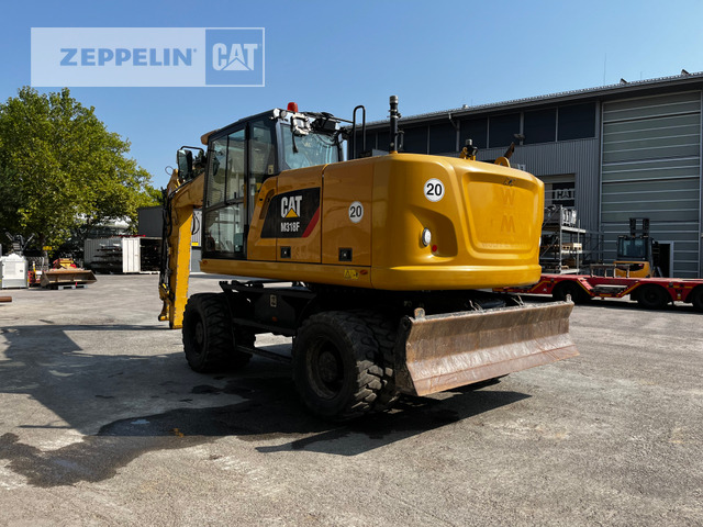 Cat M318F - Gumikerekes kotró: 2 kép. Cat M318F - Gumikerekes kotró: 2 kép.