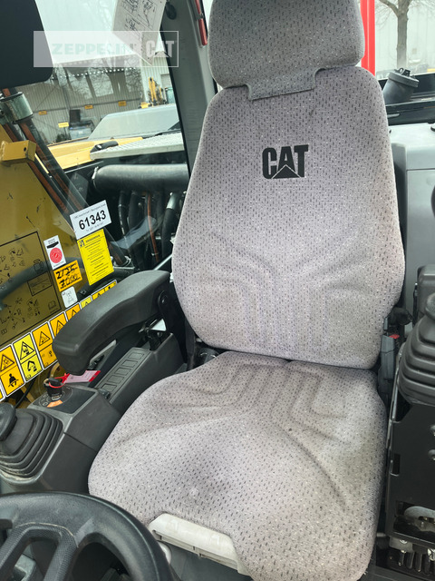 Gumikerekes kotró Cat M320F: 19 kép.